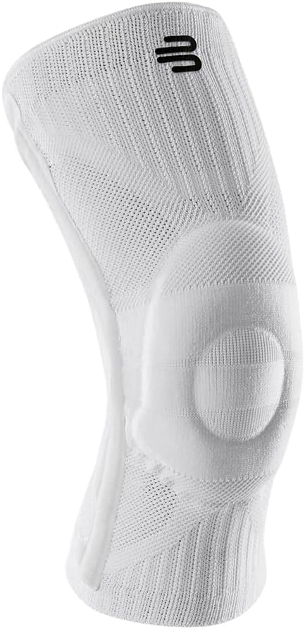 [Color] neoprene compression knee brace with targeted support panel, shown on leg during outdoor activity — view 5