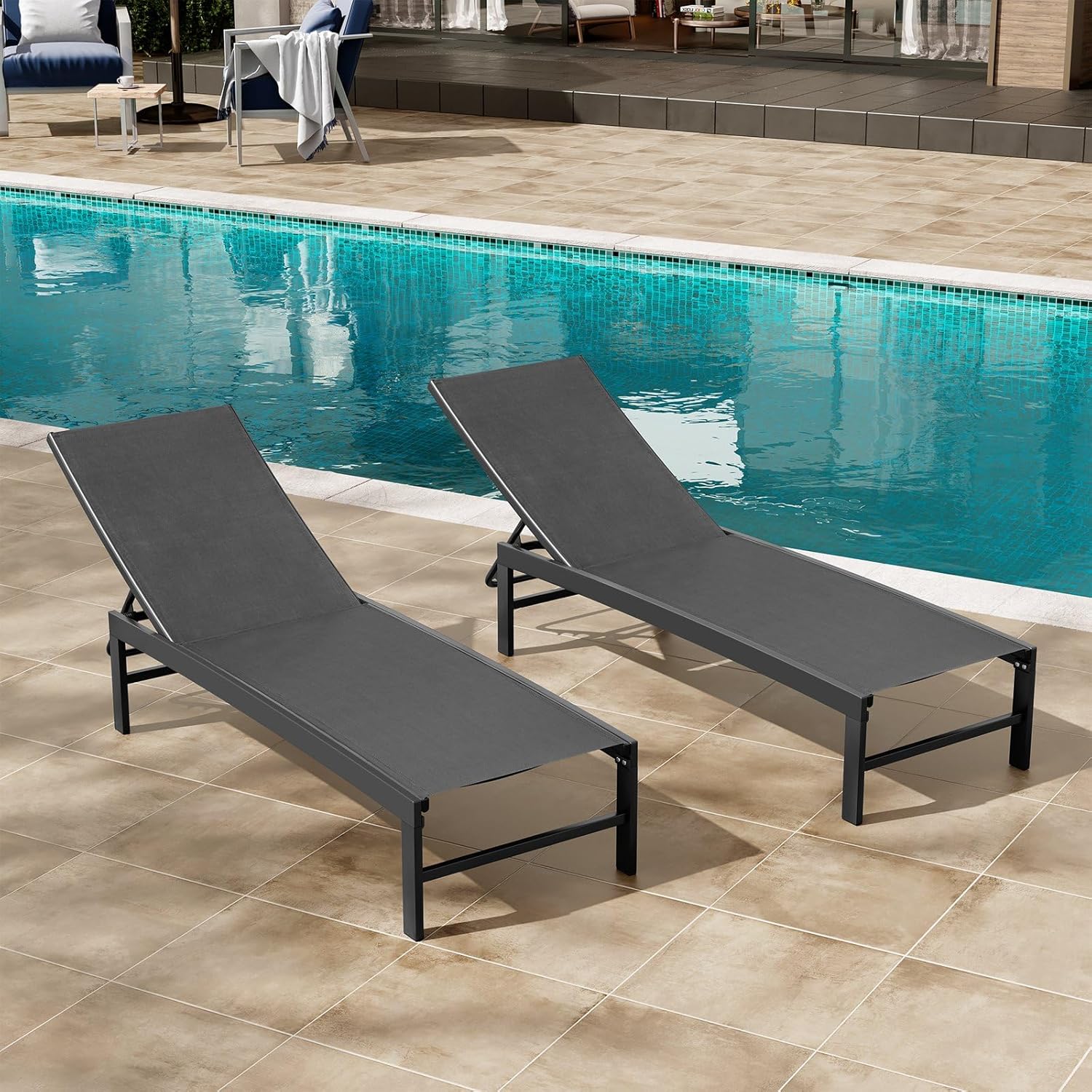 Black aluminum chaise lounge chair with five-position adjustable backrest, shown on beach or patio setting โ view 1