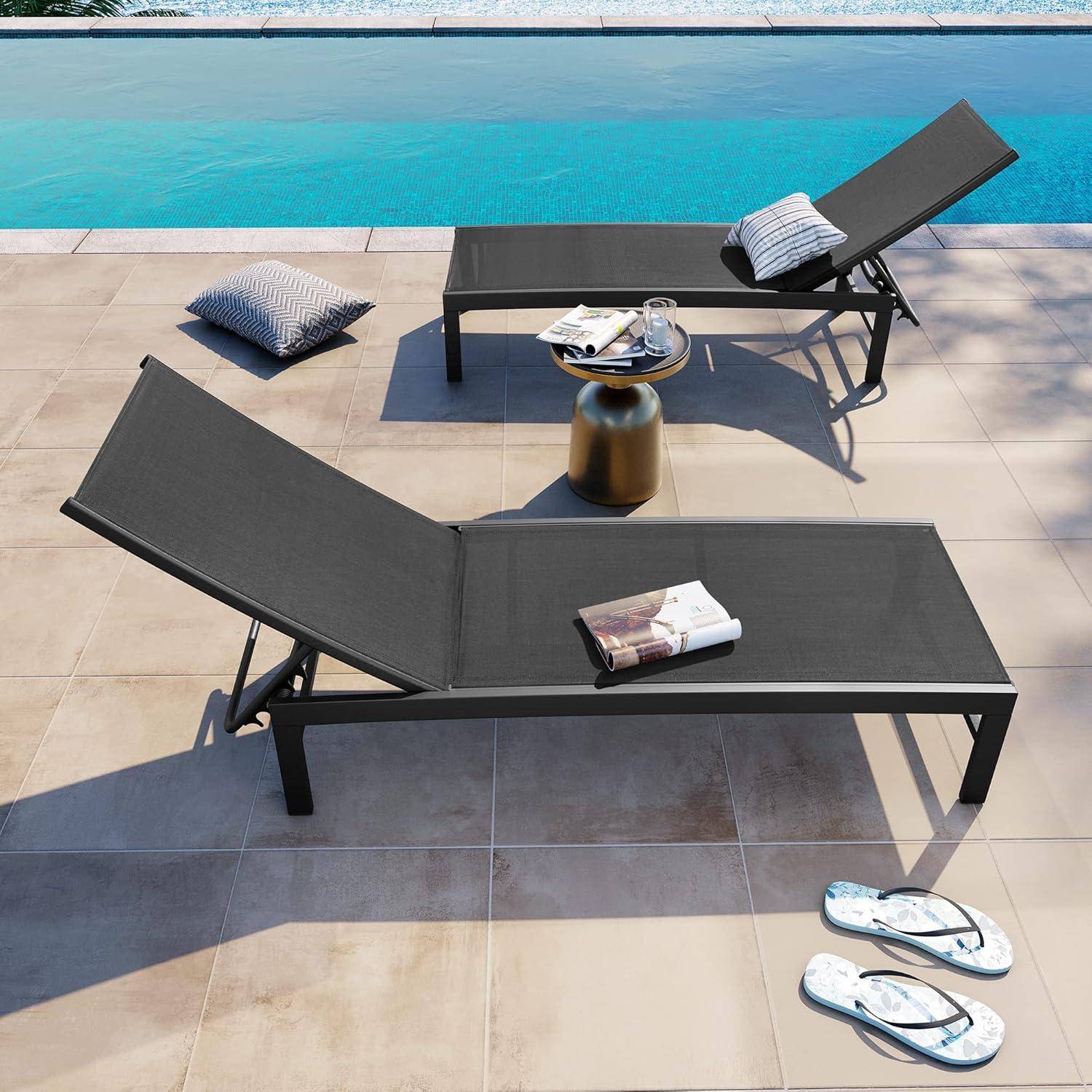 Black aluminum chaise lounge chair with five-position adjustable backrest, shown on beach or patio setting โ view 3