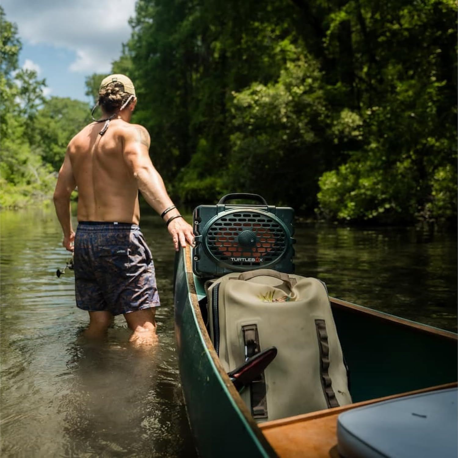 Rugged [color] waterproof Bluetooth speaker with impact-resistant polymer composite design, shown in outdoor setting — view 2